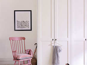Pink Rocking Chair In A Neutral Bedroom